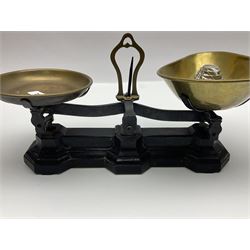 Black painted and brass kitchen balance scales with graduated set of brass weights