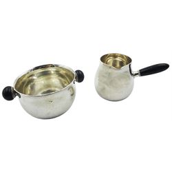 Danish sterling silver sugar bowl and cream jug by Georg Jensen, each of plain slight bellied form with ebony handles, each impressed beneath 925.S STERLING DENMARK, and marked for Georg Jensen, sugar bowl H5cm, cream jug H6cm, approximate gross weight 8.06 ozt (251 grams)

