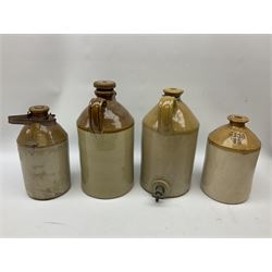 Four Hull stoneware flagons - Moors & Robsons Breweries Ltd H25cm, Hawkshaw Ltd Spencer Street Hull 1923, Triumph Herbal Brewery with brass dispensing tap and Texol Hull with screw stopper (4)  