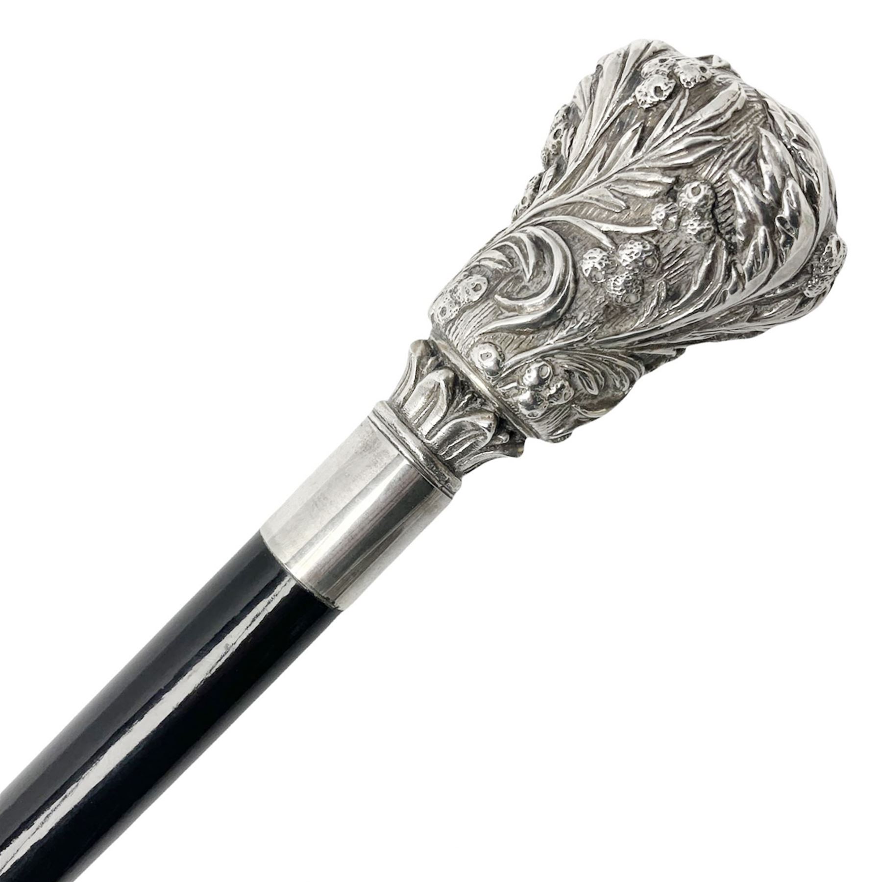 Silver topped walking cane, with embossed decoration in the Victorian taste of flowers, berries and acanthus leaves, stamped 925, upon an ebonised shaft, L94cm