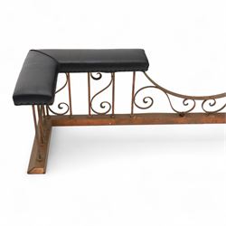 Early 20th-century Arts & Crafts copper club fender, of long serpentine form, scrolling uprights and a shaped centre support, the top rail fitted with four upholstered padded seat sections, raised on a stepped plinth base, inner dimensions 192x43cm 