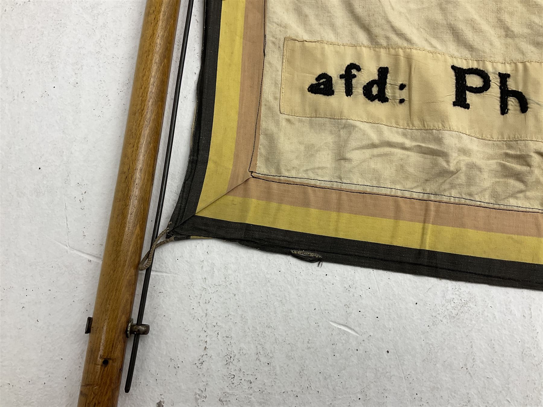 WW2 Belgian Partisan/Resistance two-sided banner embroidered in black on a cream ground 'Belgische Partisanen Korps 032 afd: Ph: De Bruyne' within a Belgian flag border; on wooden pole with gilded metal lion and laurel wreath finial