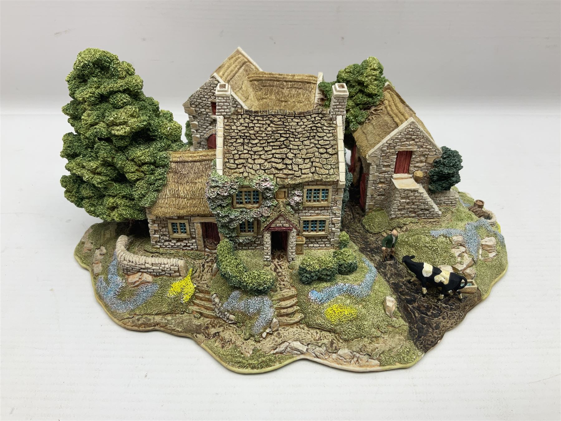 Three Lilliput lanes, comprising Oakwood Smithy, Anne of Cleves and Bluebell Farm, all with deeds and original boxes 