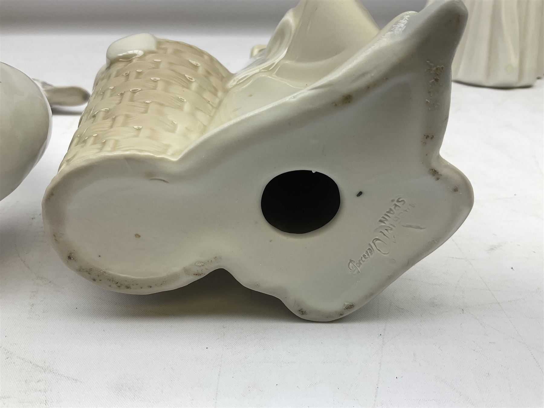 Lladro 'Walk With the Dog' figure no. 4893, together with Lladro swan figure, Porceval figure of a gentleman with a bird perched upon his hand and a further of a lady with flowers beside a basket, all with marks beneath, tallest H40cm