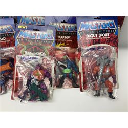 Thirty-one Masters of the Universe He-Man figures re-bagged on original backing cards;  two others lacking backing cards; boxed Modulok figure; bag of weapons and accessories; Roton, two horses and two battle cats; 1986 & 1987 Annuals; Ladybird and other story books; Panini sticker album; instructions etc