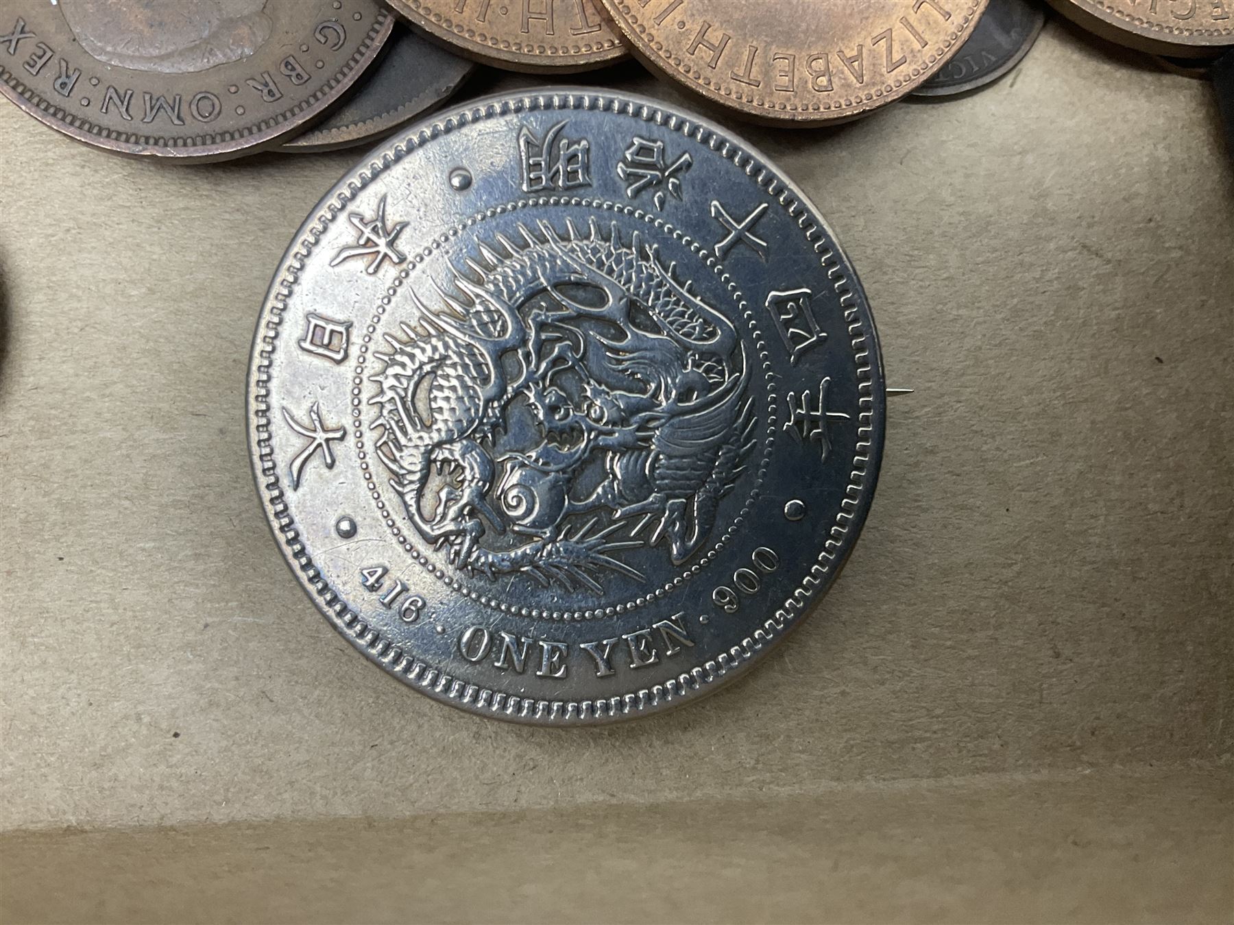 Great British and World coins and banknotes, including pre-decimal coinage, Britain's first decimal coins sets in blue folders, silver one yen coin converted into a brooch, commemorative crowns etc