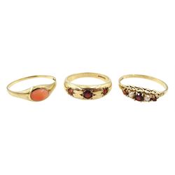 Gold coral ring, gold three stone gypsy set garnet ring and a garnet and pearl ring, all hallmarked 9ct