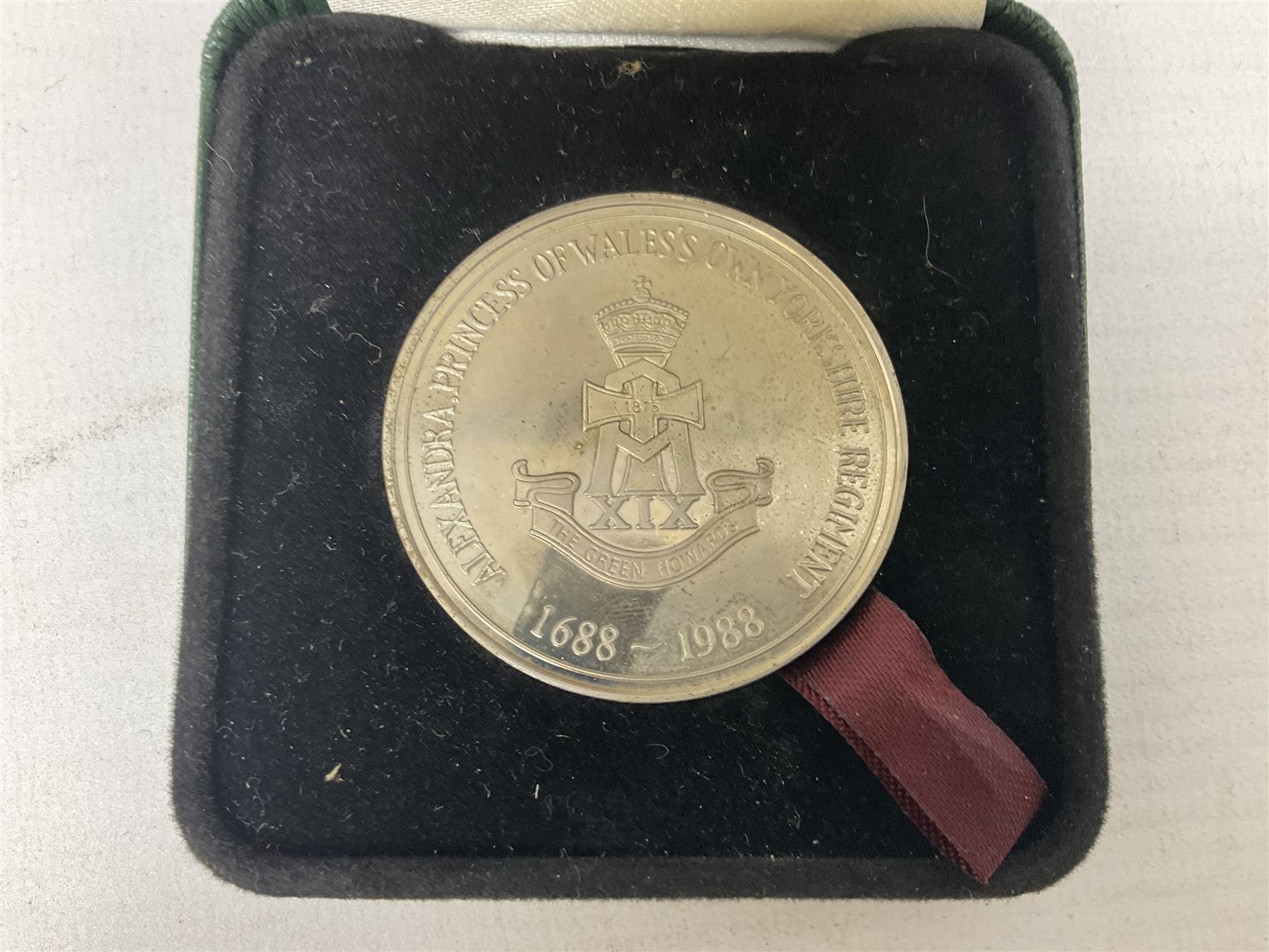 Limited edition Spode Green Howard's twin handled loving mug, no 205/300, with certificates, together with a Green Howards cased Tercentenary medal (1688-1988), cap badge and embroidered patch, largest H11.5cm