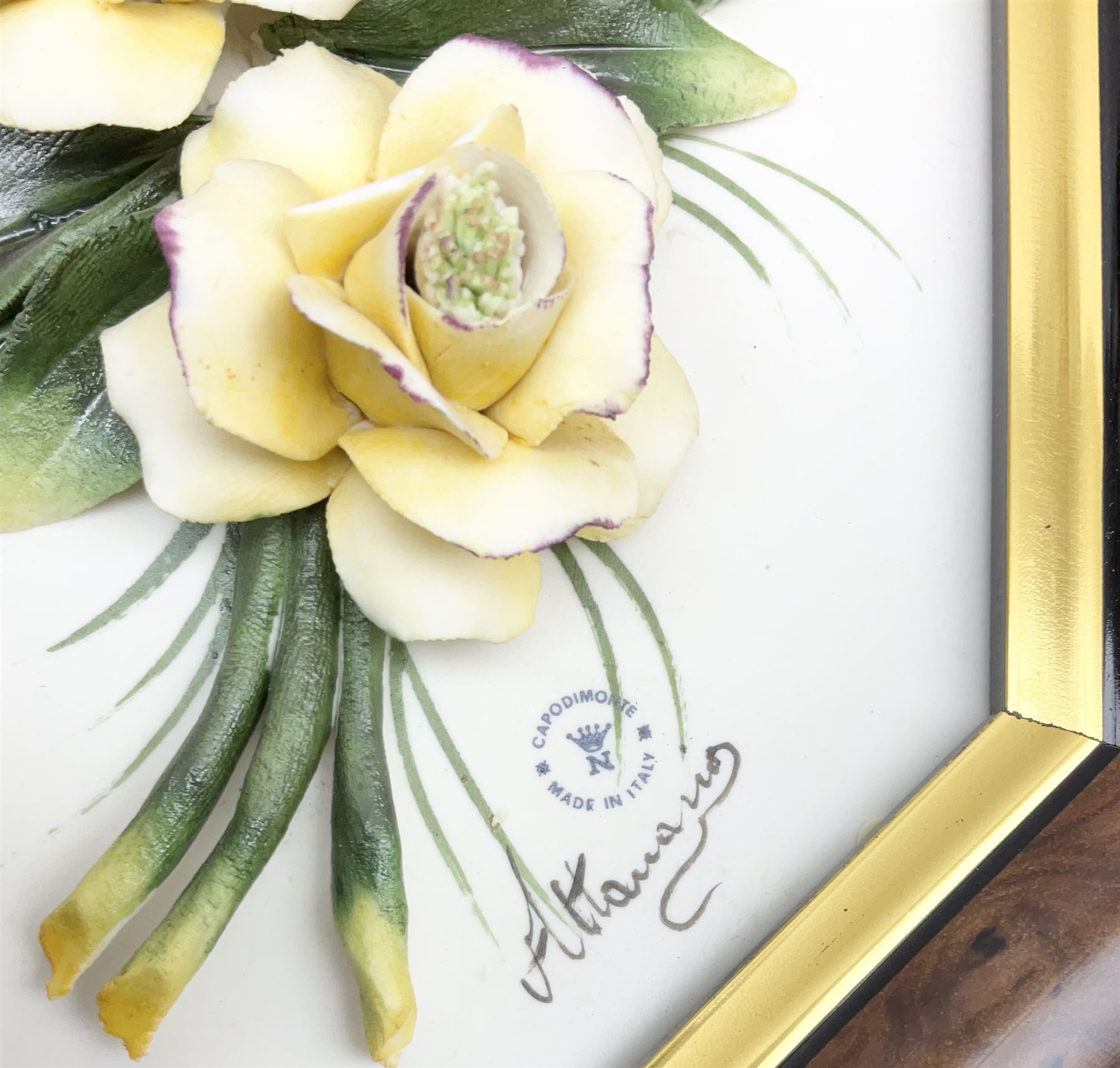 Set of three Capodimonte wall plaques, depicting floral decoration in octagonal frames with gilt edging, largest plaque H48, two small plaques H31cm.    