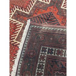 Persian Kelardasht red ground rug, the field decorated with two geometric medallions, multi-band border decorated with stylised flower heads and geometric repeating patterns