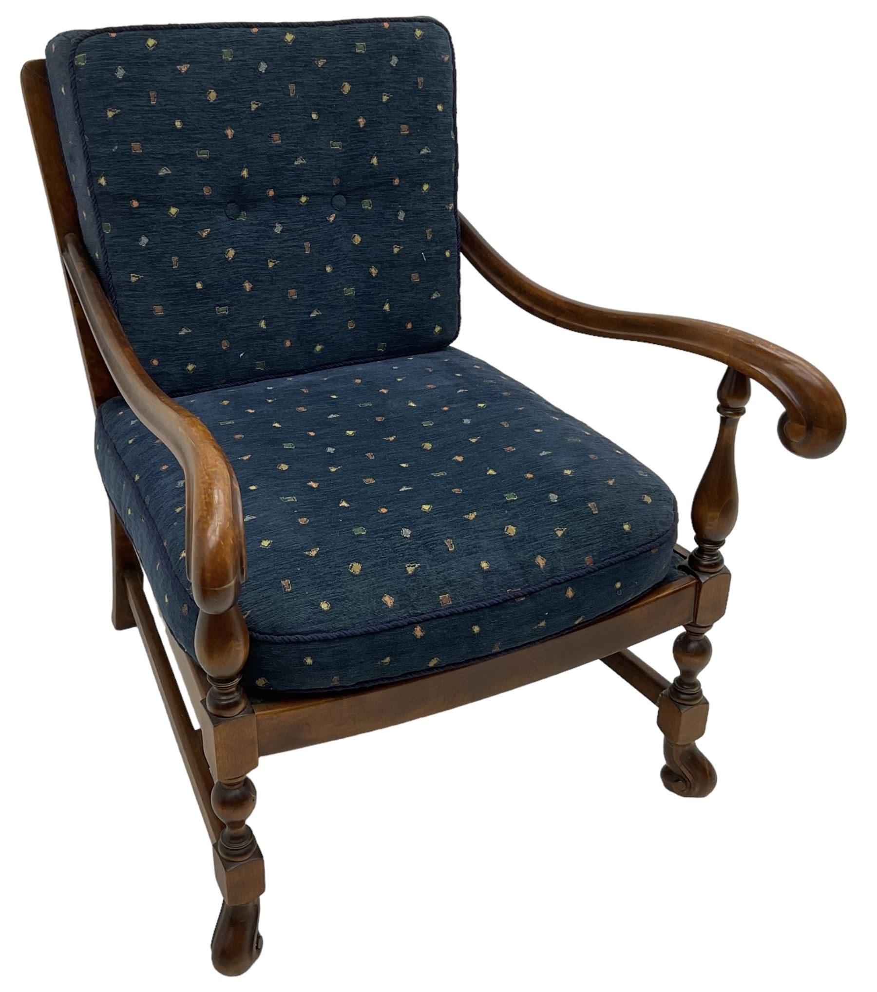 Early 20th century stained beech framed armchair, cane panel back over scrolled arm terminals, raised on turned supports united by turned H-stretcher, with patterned blue upholstered loose back and seat cushions