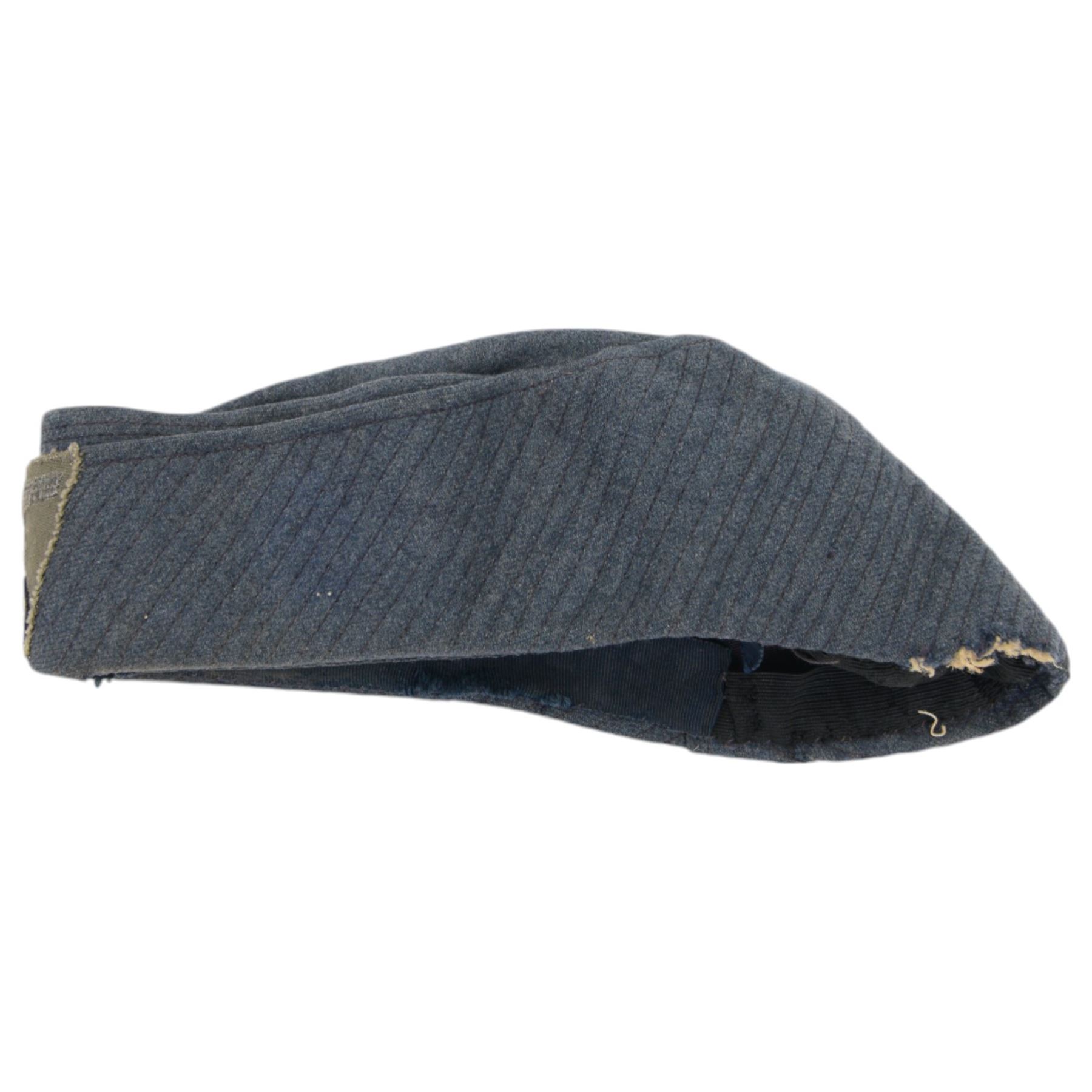 Four German style badges, including Iron Cross, German Proficiency SS runes badge, etc together with a reproduction German cap 