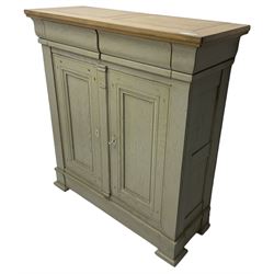 Painted oak side cabinet, rectangular oak top over two drawers and two panelled cupboards, the interior fitted with two adjustable shelves, on stepped plinth base with compressed block feet, in washed laurel green paint and waxed finish