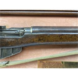 WW2 Lee Enfield No.4 Mk.1 .303 bolt-action rifle with hinged butt compartment, made by SA Ltd., Long Branch, Canada 1942, serial no.5L0646 L113cm; mounted on a framed display board with No.4 Mk.II spike bayonet, No.9 Mk.1 blade bayonet, two inert 5-round clips and brass biographical plaque by Antler Military Originals detailing DA Cert No.C3444 OLD STYLE DEACTIVATION SO FIREARMS CERTIFICATE REQUIRED OR RFD