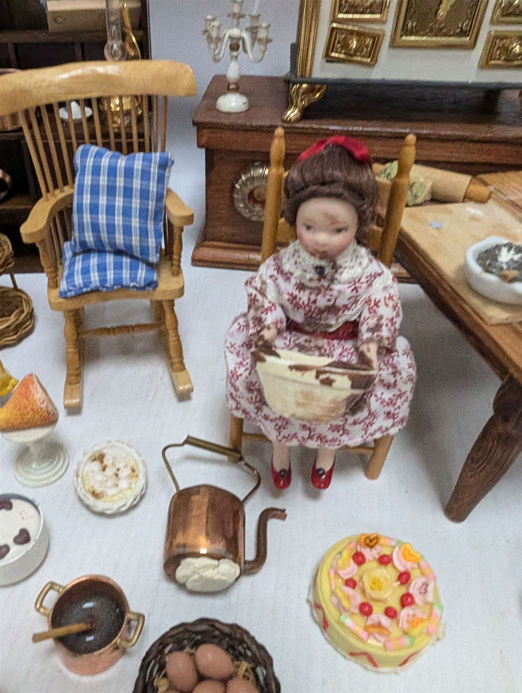 Victorian and later style dolls house kitchen furniture, including countertop, dresser displaying copper pots and blue and white ceramics, baking table, oven, three figures and a collection of food and baking accessories