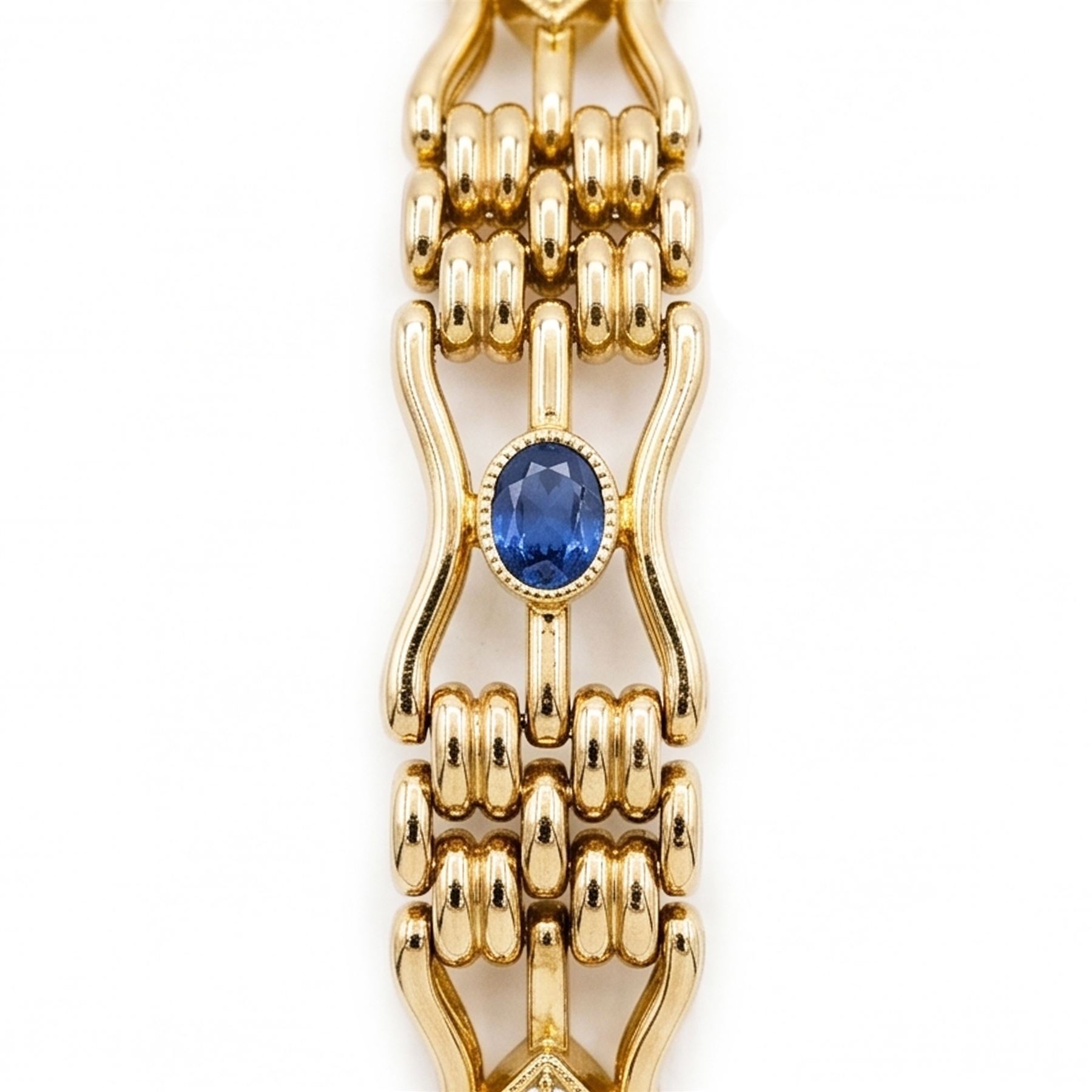 Early 20th century 15ct diamond and sapphire gate link bracelet, set with two oval cut sapphires and two old cut diamonds, stamped 15
