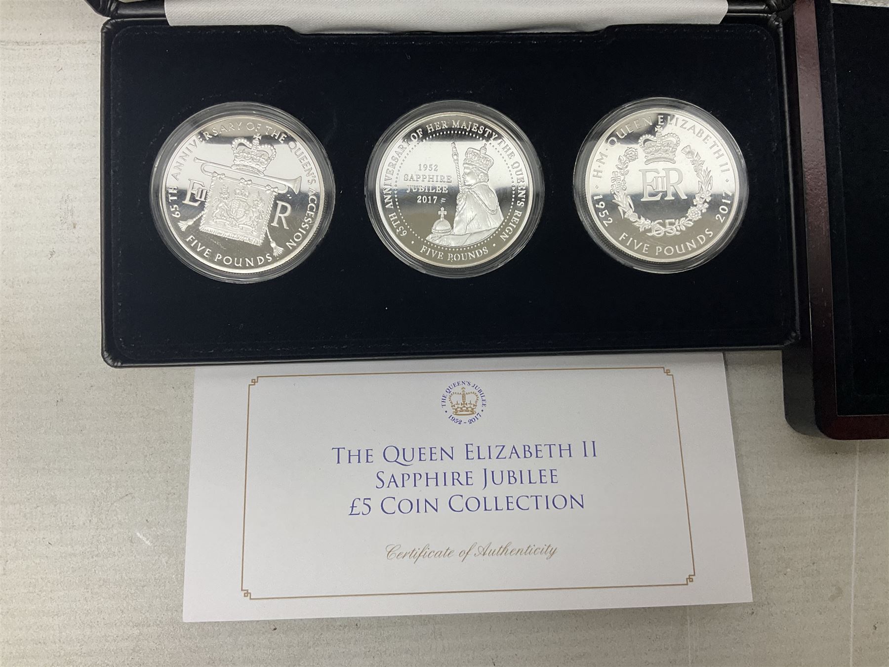Mostly commemorative coins including The Royal Mint 1997 proof coin collection, Westminster 2013 'The Royal Baby Photographic 65mm' coin, Jubilee Mint 2017 'The Queen Elizabeth II Sapphire Jubilee' five pound coin collection etc