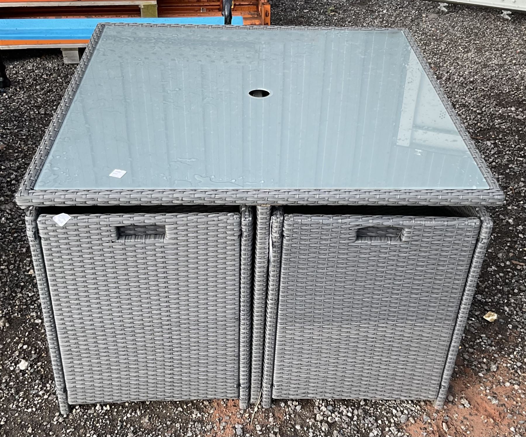 Square rattan garden table and four tuckaway chairs THIS LOT IS TO