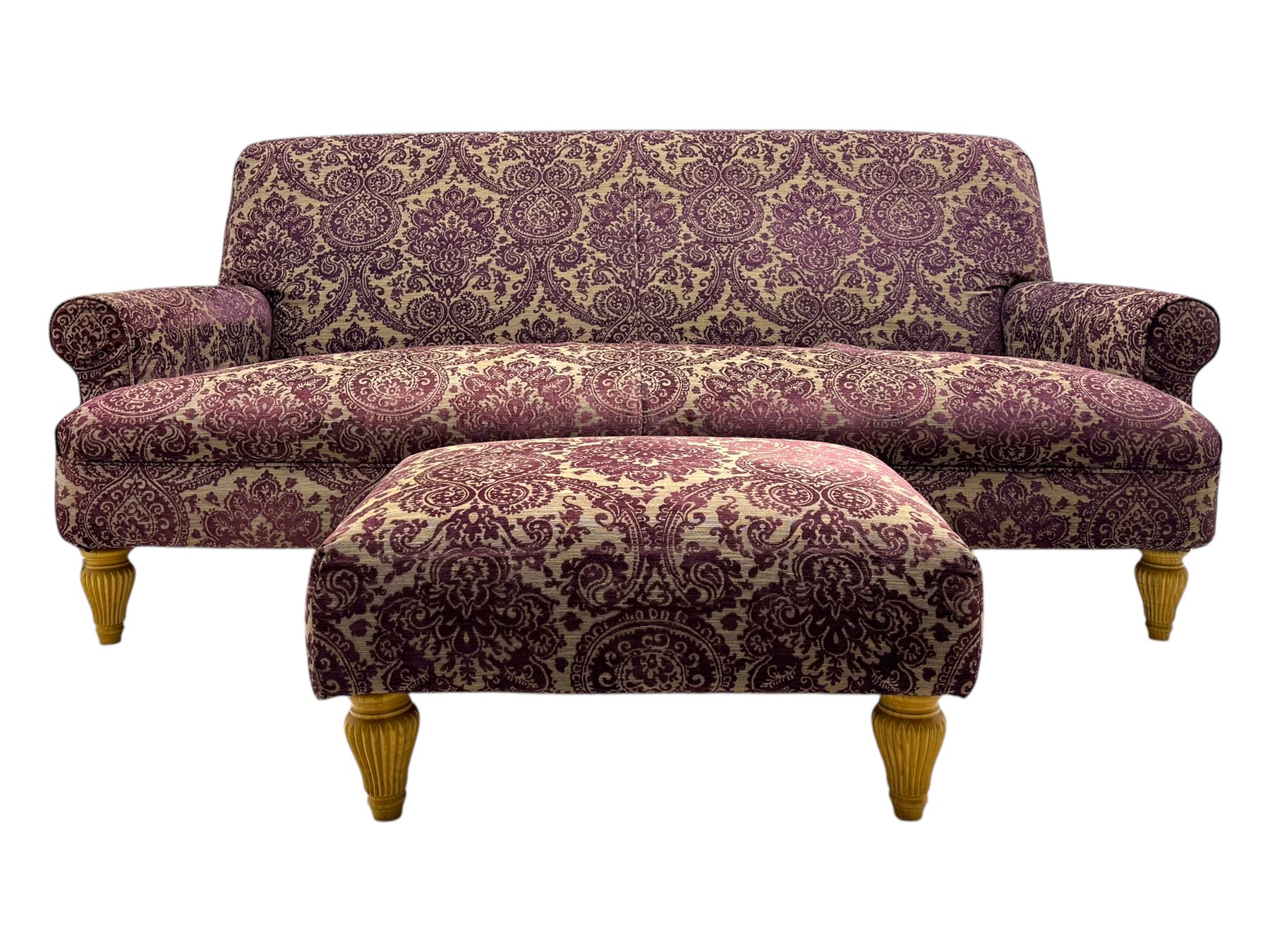 Multi-York - contemporary two-seat sofa, upholstered in damask fabric in shades of burgundy and beige, raised on turned and fluted supports; complete with matching footstool