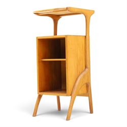 Mid-20th century teak side table with sliding top tray, raised sliding top above an open recess with two shelves, shaped frame support
