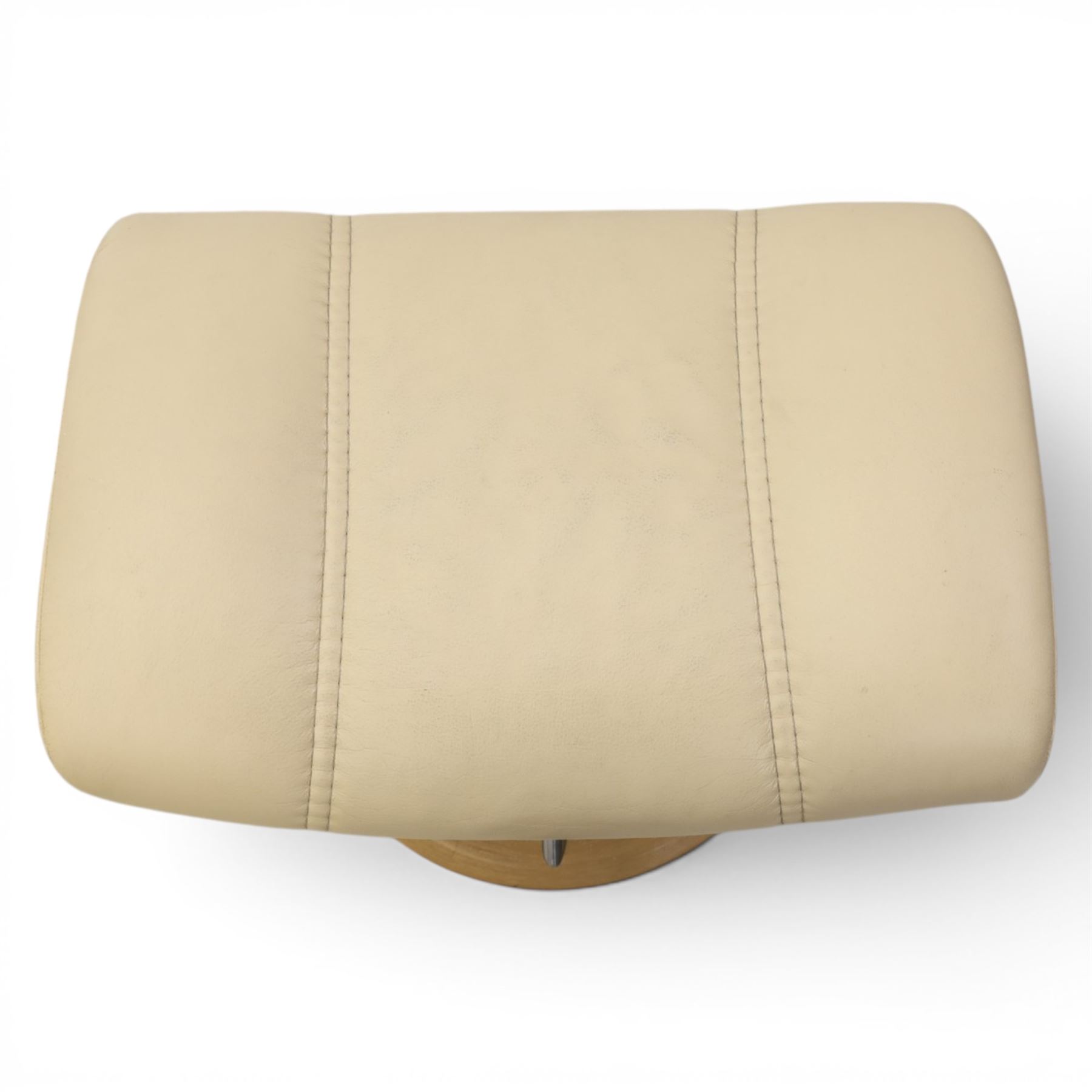 Ekornes - Stressless reclining beige leather armchair and stool, raised on brushed steel frame, light oak rotating base