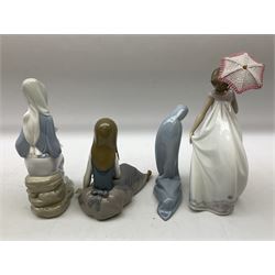 Four Lladro figures, comprising Afternoon Promenade no 7636, Nostalgia no 5071, both with original boxes, Girl with Lilies no 4972 and Madonna no 4534, largest example H27cm