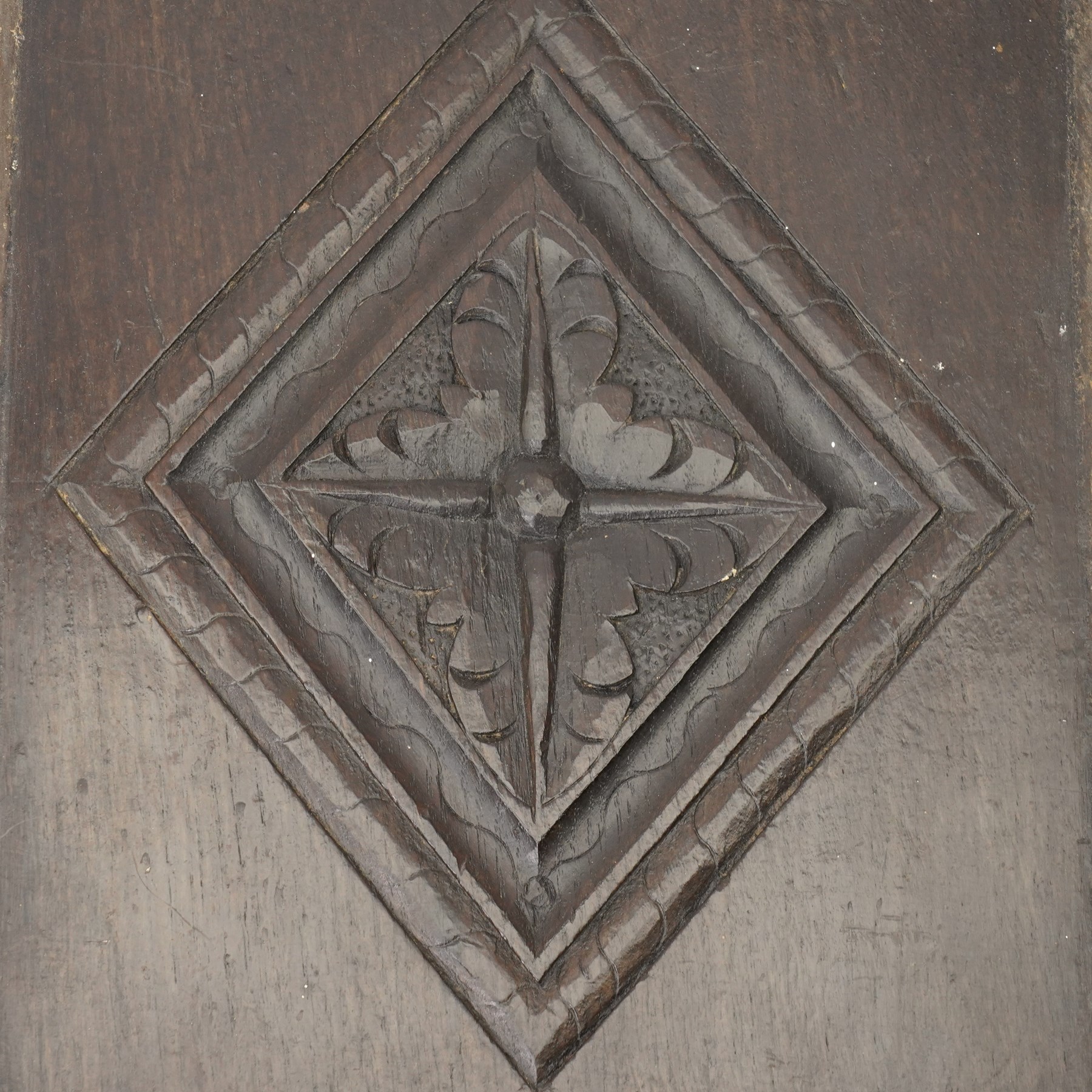 Set of four 17th century carved panels with lozenge decoration, and three further carved panels, lozenge panels approx 36.5cm x 24cm, three further 35cm x 10cm 
