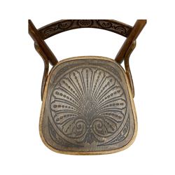 Jacob & Josef Kohn - set of four early 20th century Austrian bentwood chairs, each with carved decoration to the shaped backrest and shaped seat, on splayed supports with stretchers, marked with the manufacturer's stamp and paper label beneath