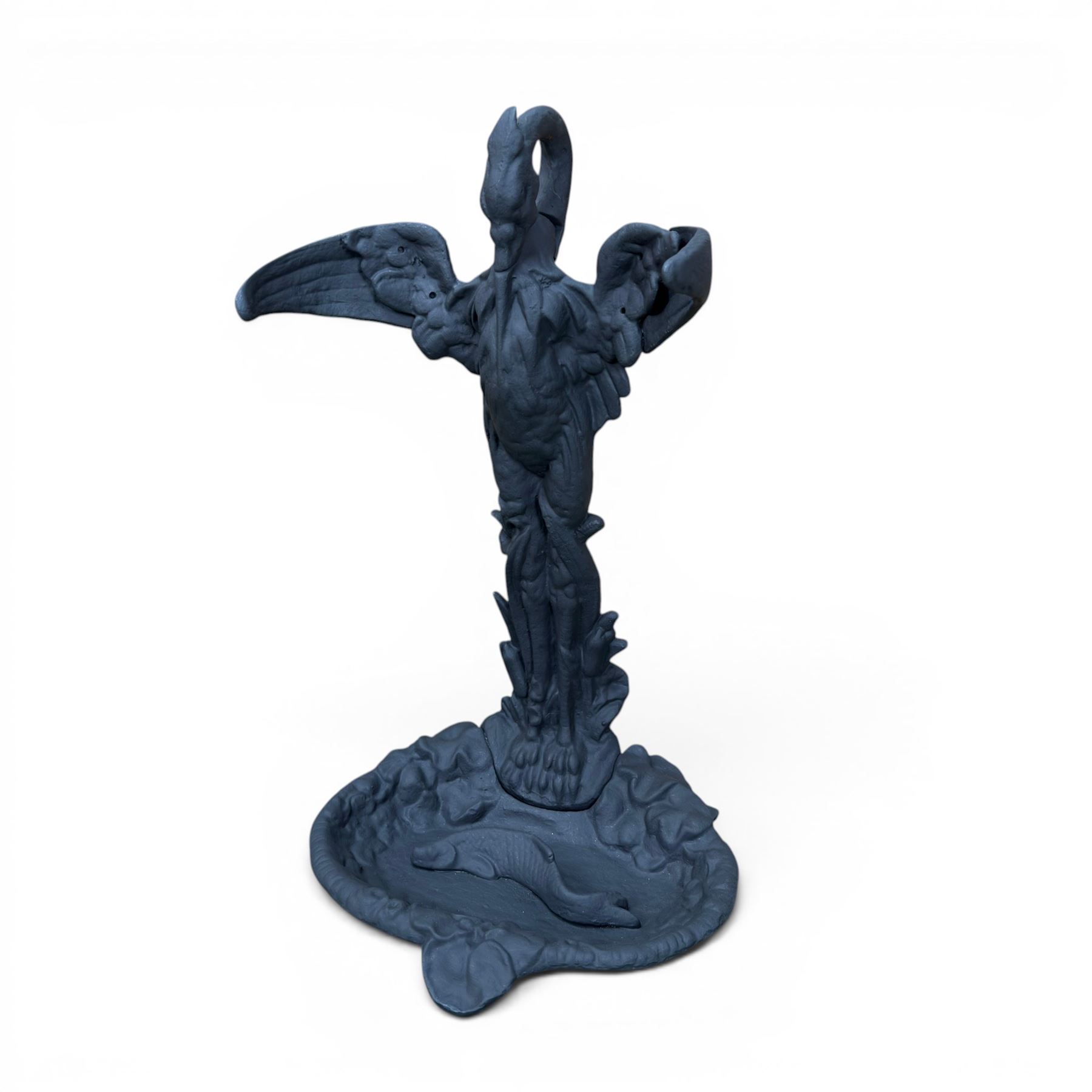 After Coalbrookdale cast iron heron stick stand, ornate detail with fish base, painted in matt black, 20th century
