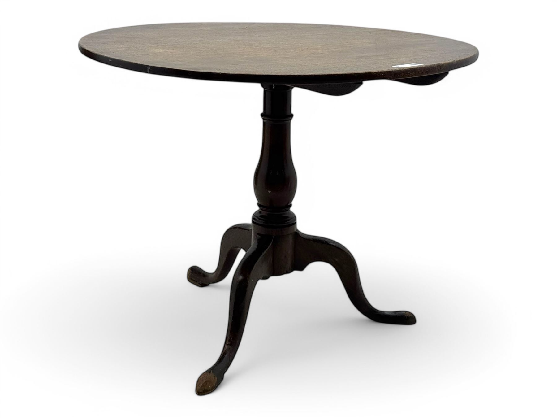 19th century mahogany tilt-top occasional table, circular top on a turned baluster column, raised on three splayed supports