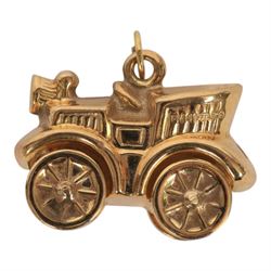 Four 9ct gold charms including penny-farthing, car, lamp and well, all hallmarked