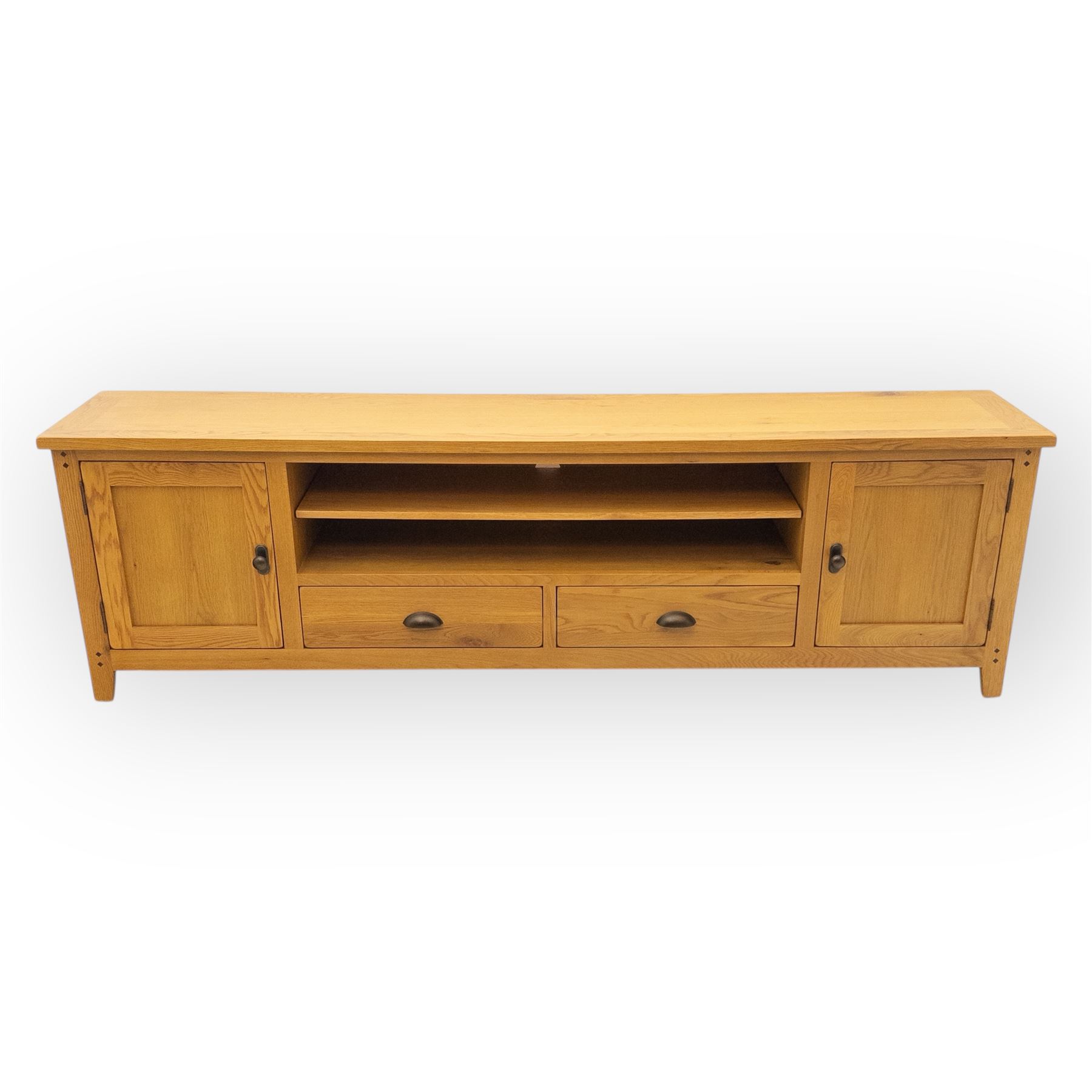 Cotswold & Co - large light oak media stand, rectangular top above central open shelf, double drawer flanked by two panelled cupboard doors, fitted with metal cup and knob handles