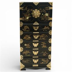 Japanese Shibayama style black lacquered curio chest, cupboard doors enclosing four short over two long fitted drawers, decorated in gilt with birds, flowers and landscape scenes, raised on gilt mounted bracket feet