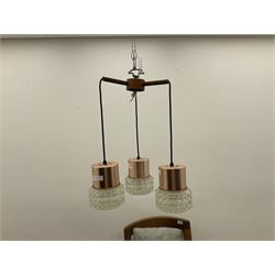 Mid century teak light fitting with three drop down clear glass pendants and copper mounts, H54cm 