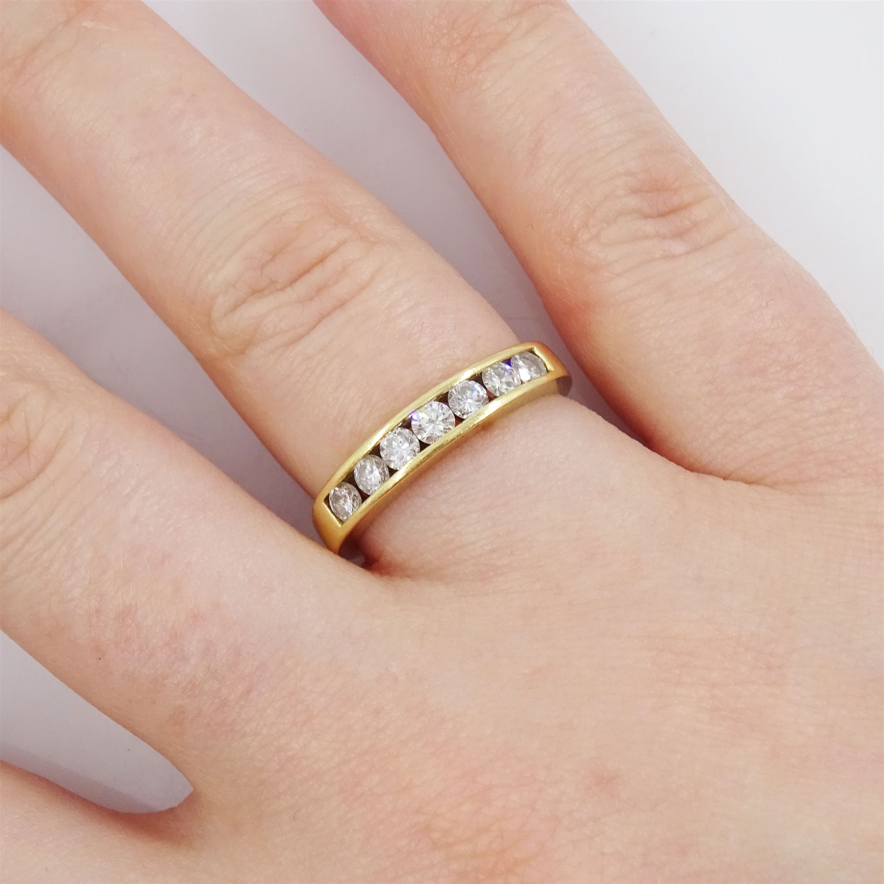 18ct gold channel set, round brilliant cut diamond half eternity, hallmarked, total diamond weight 0.50 carat