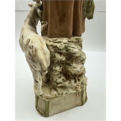 Pair of Royal Dux figures, no. 1115, modelled as a shepherd with a goat by his side and a shepherdess feeding a lamb, each wearing flowing green and pink robes with gilt detailing, with pink triangle mark beneath, H51cm