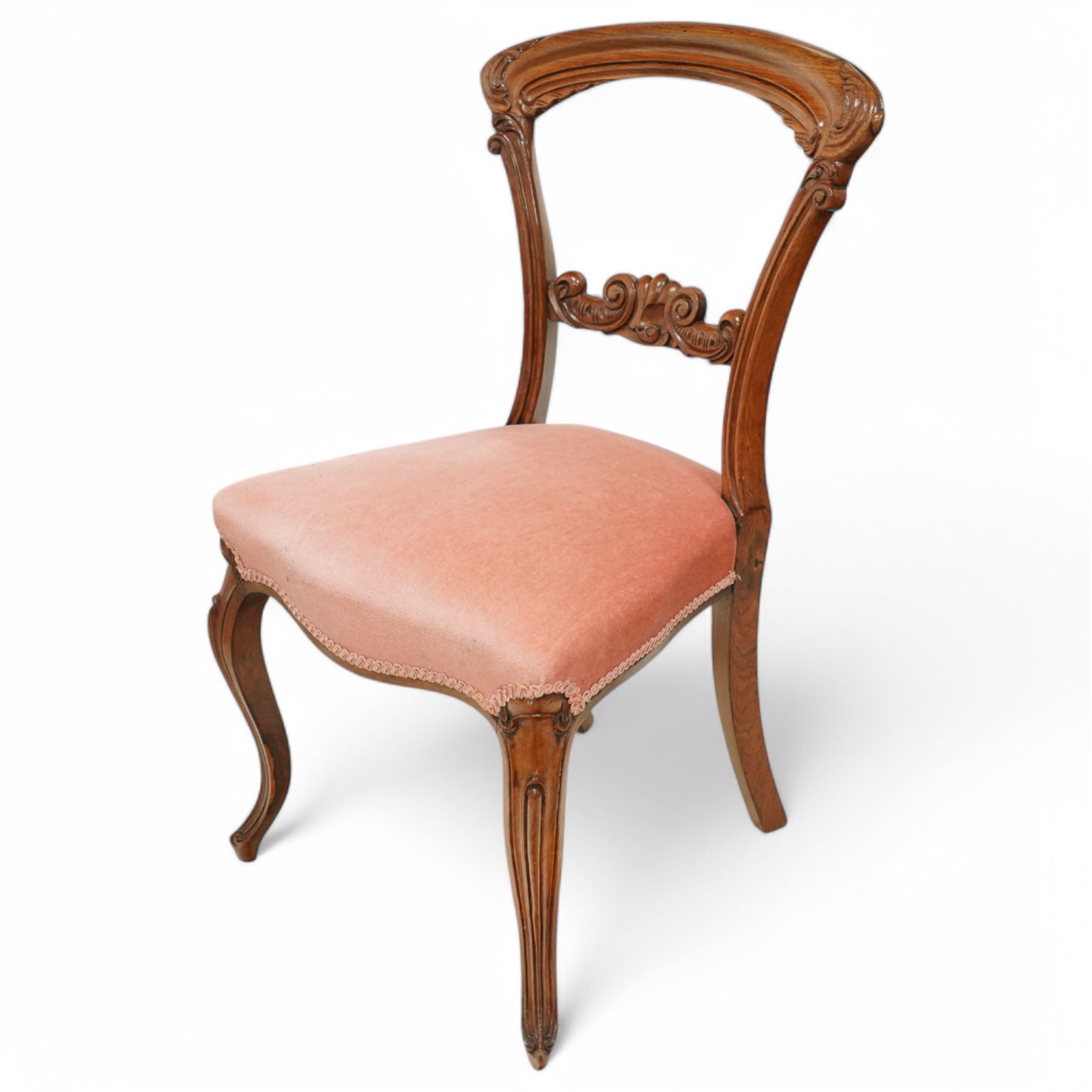 A pair of Victorian walnut balloon back parlours chairs, with carved top rail and back splat with cabriole style legs, Together with a pair Victorian mahogany balloon dining chairs