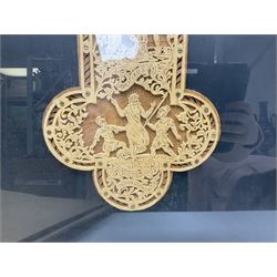 Cork carving of a religious cross depicting intricate scenes of various religious figures and motifs amongst trees and foliage, with central circular panel of Jesus Christ, in glazed frame, H95cm
