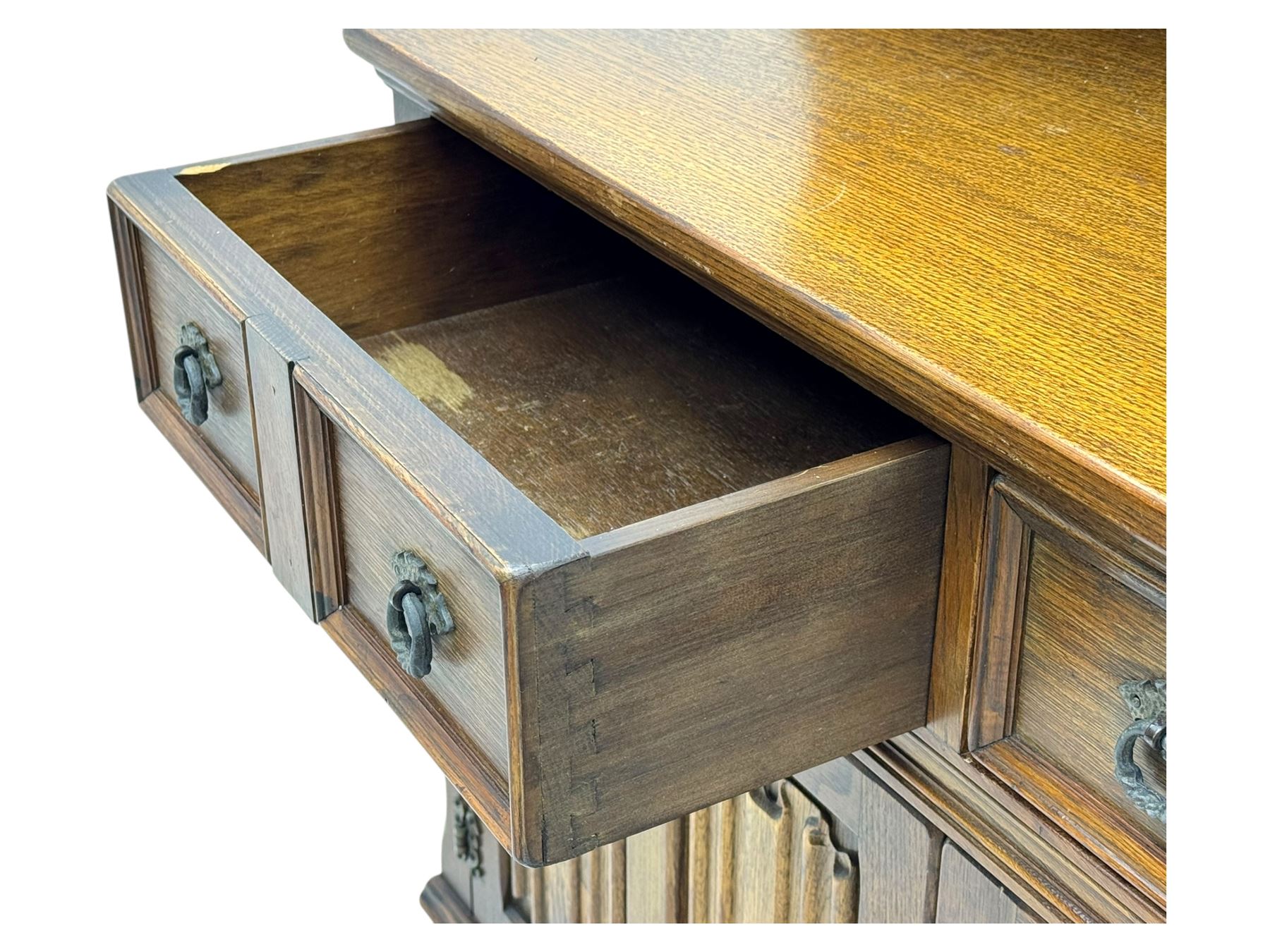 Large mid-20th-century oak dresser with two astragal glazed doors between gallery shelf and lower shelf, with three short drawers and lower section with four drawers and three double-panelled linen-fold hinged cupboard doors 