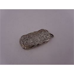 Victorian silver vinaigrette, of oval form with shaped rim, with engraved scrolling and foliate decoration and cartouche with initials, with foliate pierced gilt interior, hallmarked David Pettifer, Birmingham 1855, L4.3cm