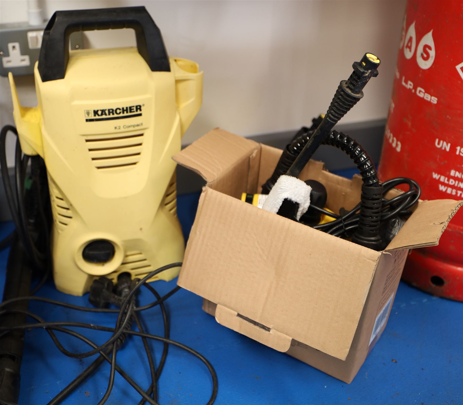 Karcher professional BR 30/4 C upright scrubber dryer floor cleaner; and a Karcher K2 compact pressure washer 