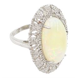 Silver opal and diamond ring, the cabochon opal of approx 9.65 carat, with round brilliant cut diamond surround, in a pierced design setting, stamped, total diamond weight approx 1.50 carat