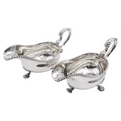 Pair of George III silver sauce boats, each of typical form with gadrooned rim, and acanthus capped scroll handle, upon three shell mounted shell pad feet, hallmarked George Methuen, London 1760 including handle H13cm, approximate total weight 30.25 ozt (941 grams)
