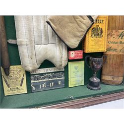 Four framed sporting memorabilia displays, the largest example containing 1930s cricket memorabilia, together with two fishing displays and a football display, each within wooden glazed frames, largest H105cm