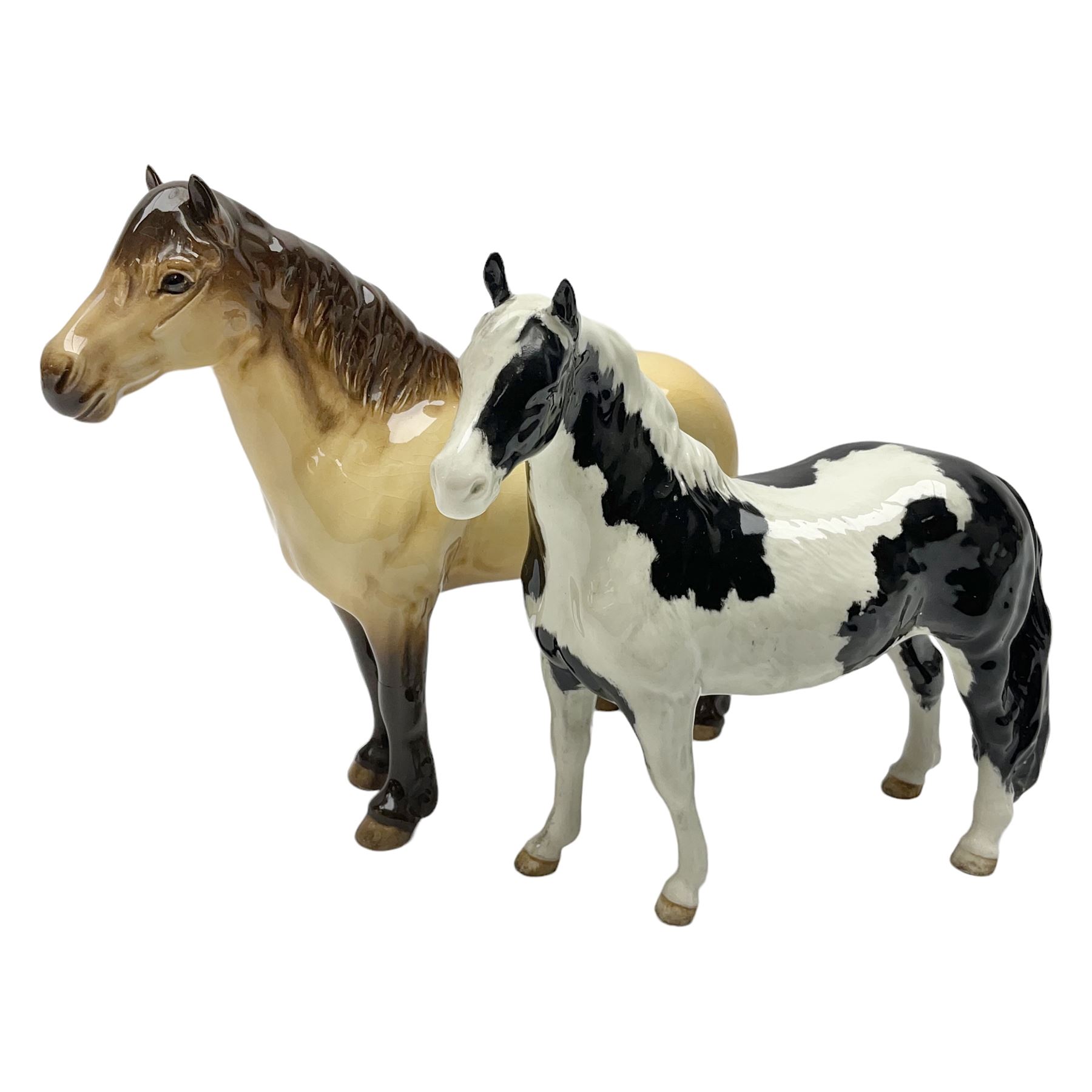 Beswick dun Highland pony no 1644 and piebald Pinto Pony  no 1373, both with printed mark beneath