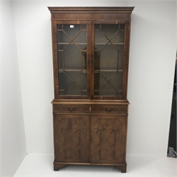 Georgian style yew wood bookcase on cupboard, two doors enclosing two shelves above two drawers and two cupboards on shaped bracket supports, W93cm, H197cm, D38cm
