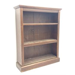 Edwardian mahogany open bookcase, chamfered rectangular top over fluted uprights and three adjustable shelves, plinth base