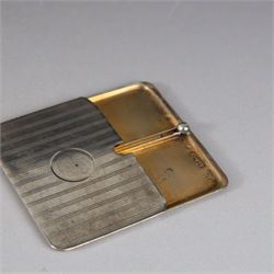 Two silver stamp cases, comprising Victorian silver mounted example with leather interior and engraved monogram to cover, hallmarked George Unite, Birmingham 1897, and a 1920s sliding example with engine turned decoration and vacant cartouche, hallmarked Sydney & Co, Birmingham 1924