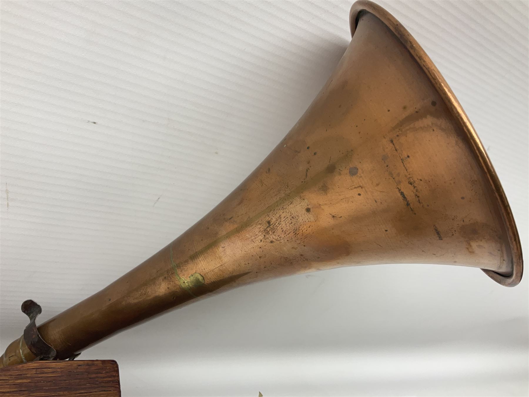 Fruitwood and elm single string phono fiddle with long neck and copper horn L76cm; and a violin bow (2)