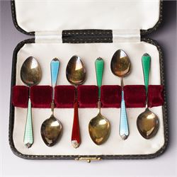 Set of six silver gilt coffee spoons with coloured enamel stems, cased Birmingham 1962 in Walker & Hall case
